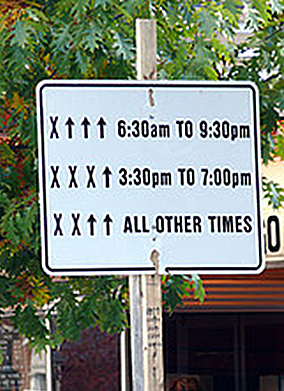 A sign in front of a buildingDescription automatically generated
